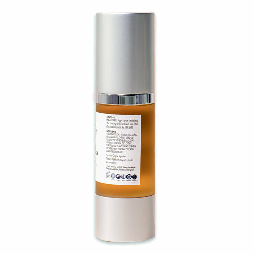 Skincare bottle with silver cap and brown body on a white background