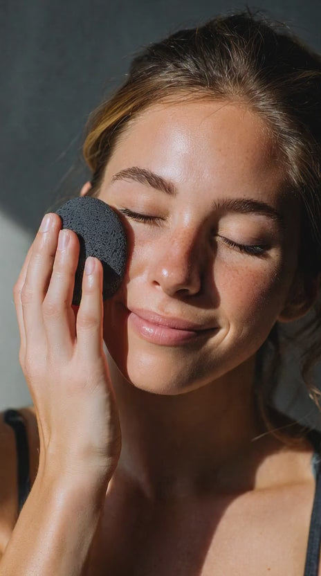  A woman using Japanese charcoal sponge